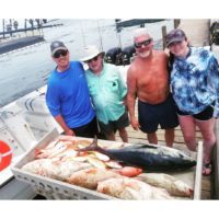 family over fish caught from deep sea fishing